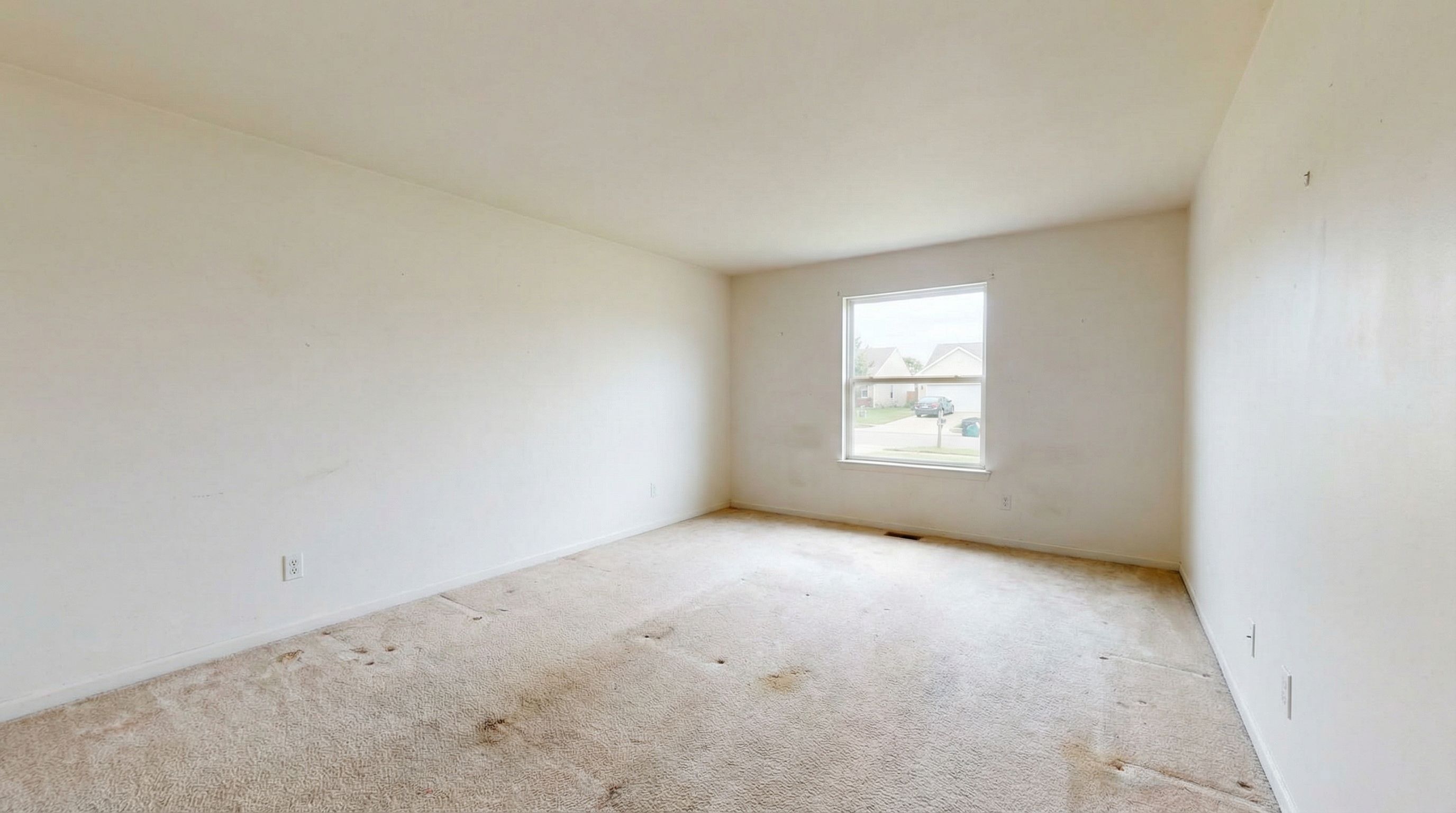 Empty living room before transformation