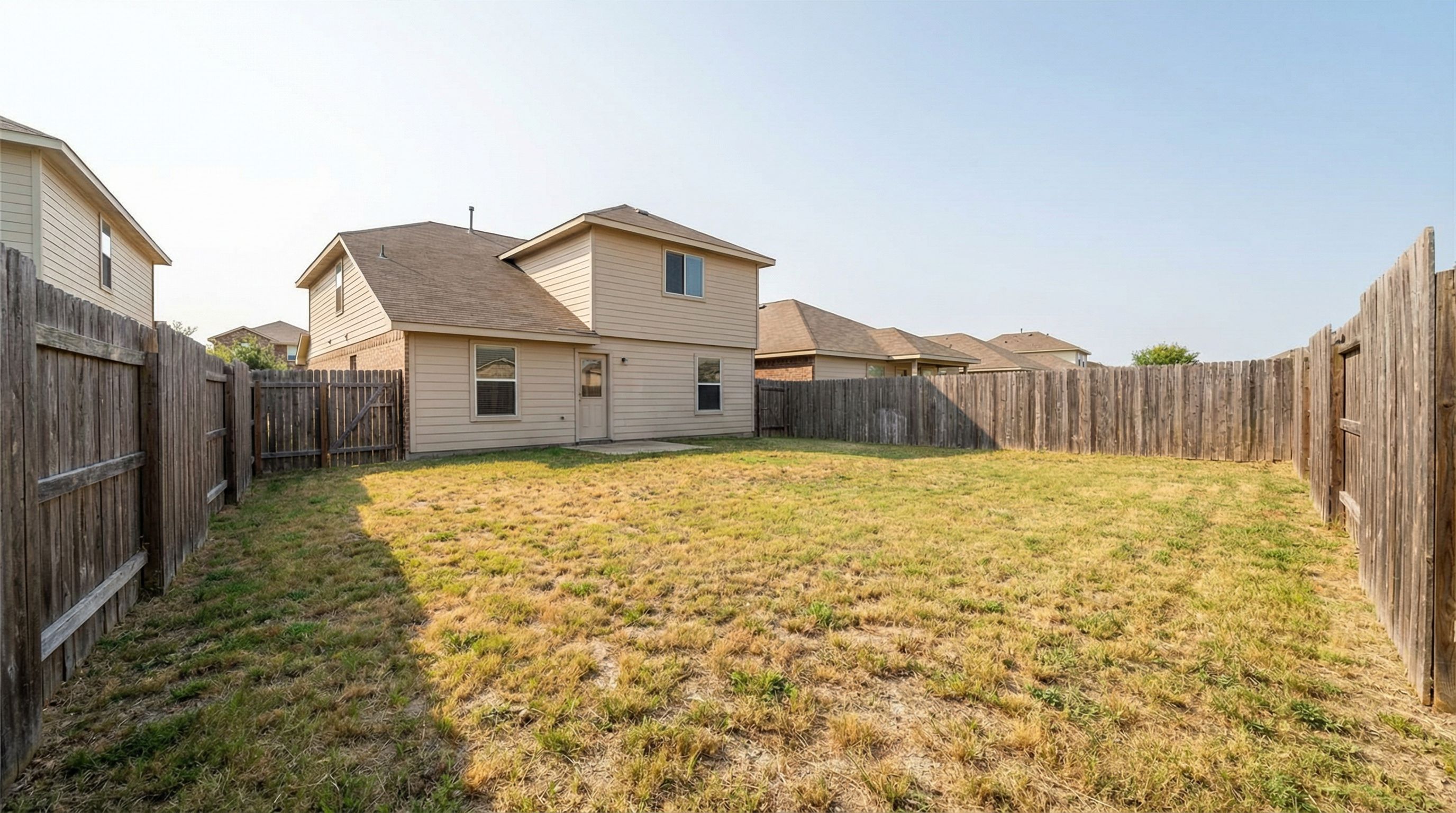Empty backyard before transformation